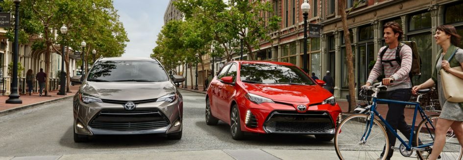 Two 2019 Toyota Corollas parked side-by-side at an intersection